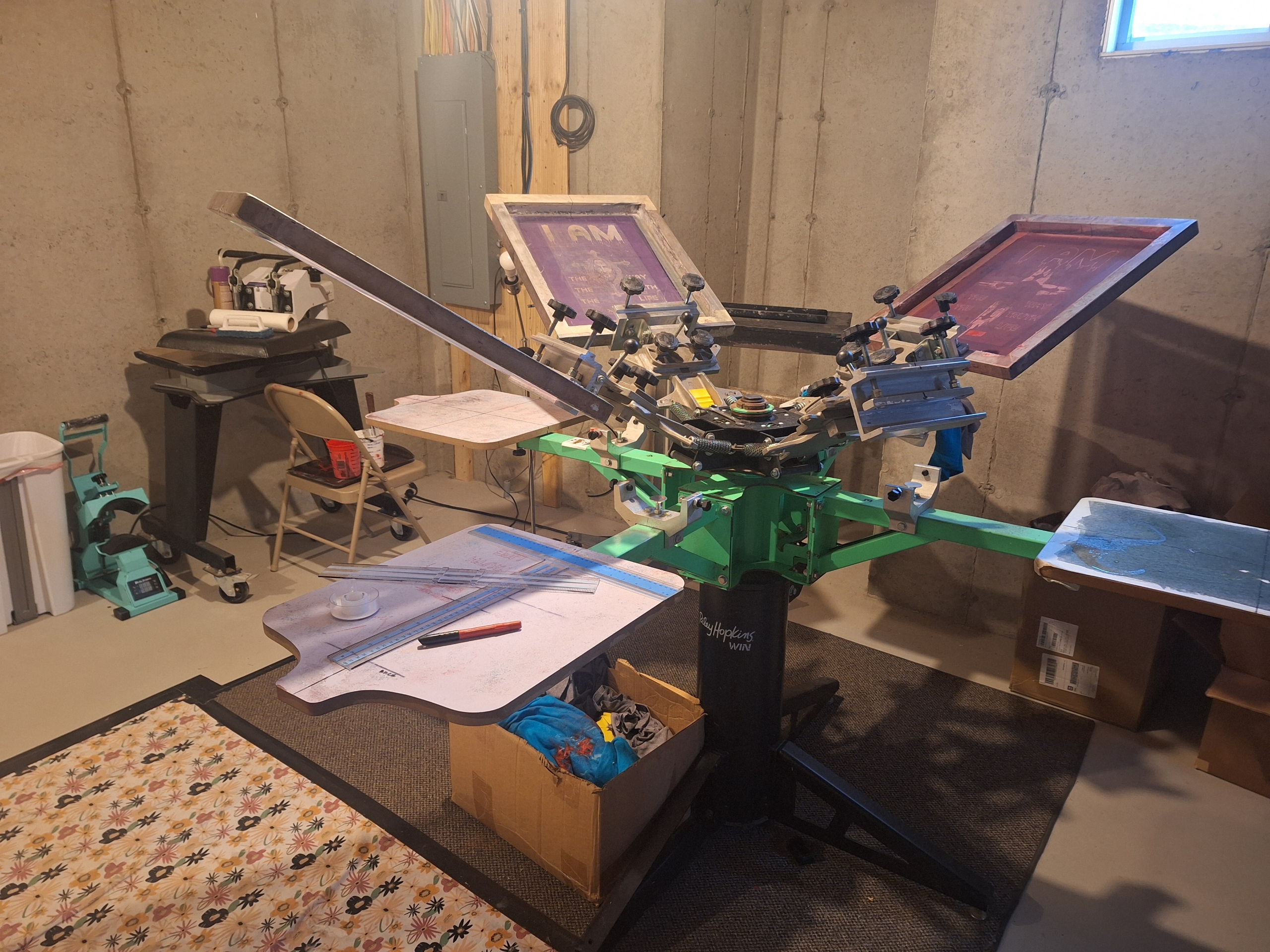 The basement screen-print press in Boston where every NVUS Hearts shirt is pressed by hand