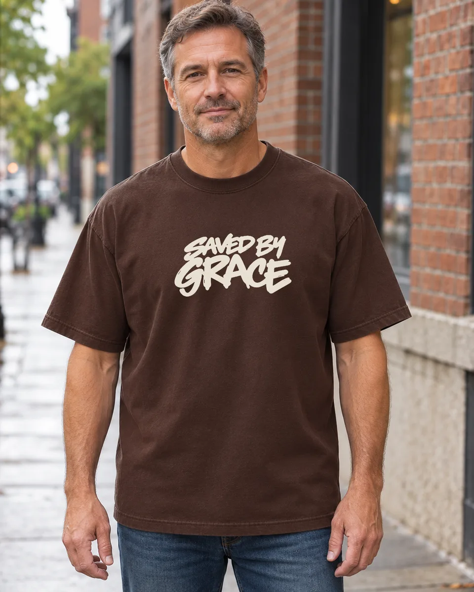 Man wearing the brown Living Proof Heavyweight Tee, front chest print