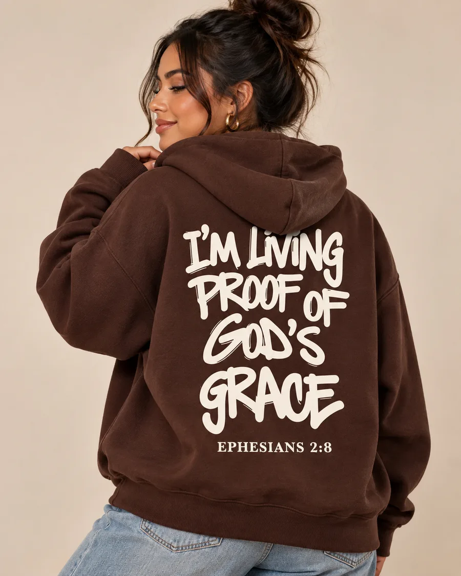 Model wearing the chocolate Living Proof Hoodie, back print